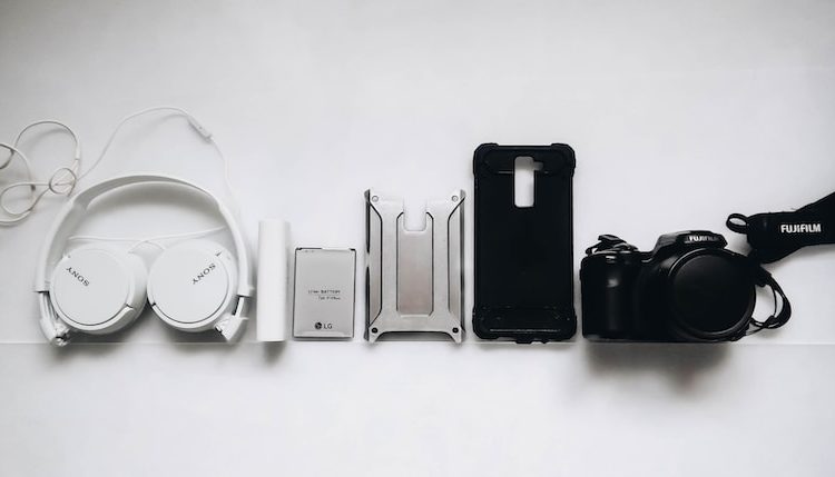 white Sony headphones and black smartphone case